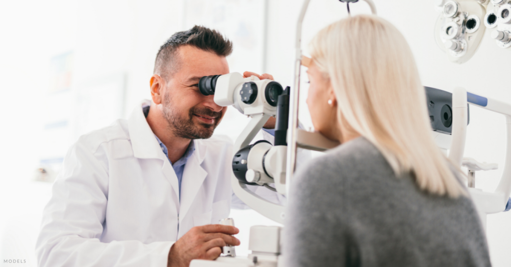 An eye doctor during a cataract consultation (model).